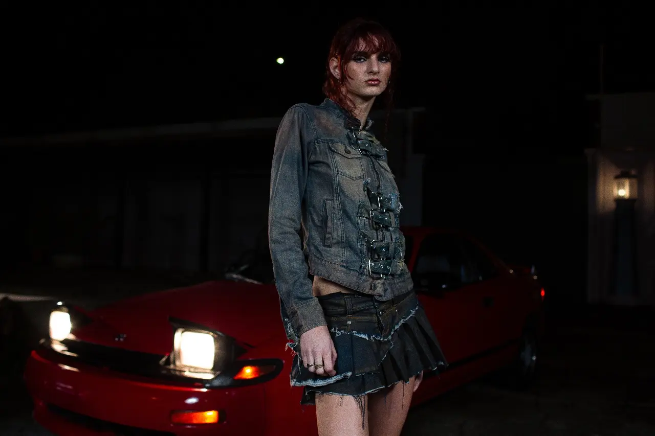 Person beside a car during a night commute
